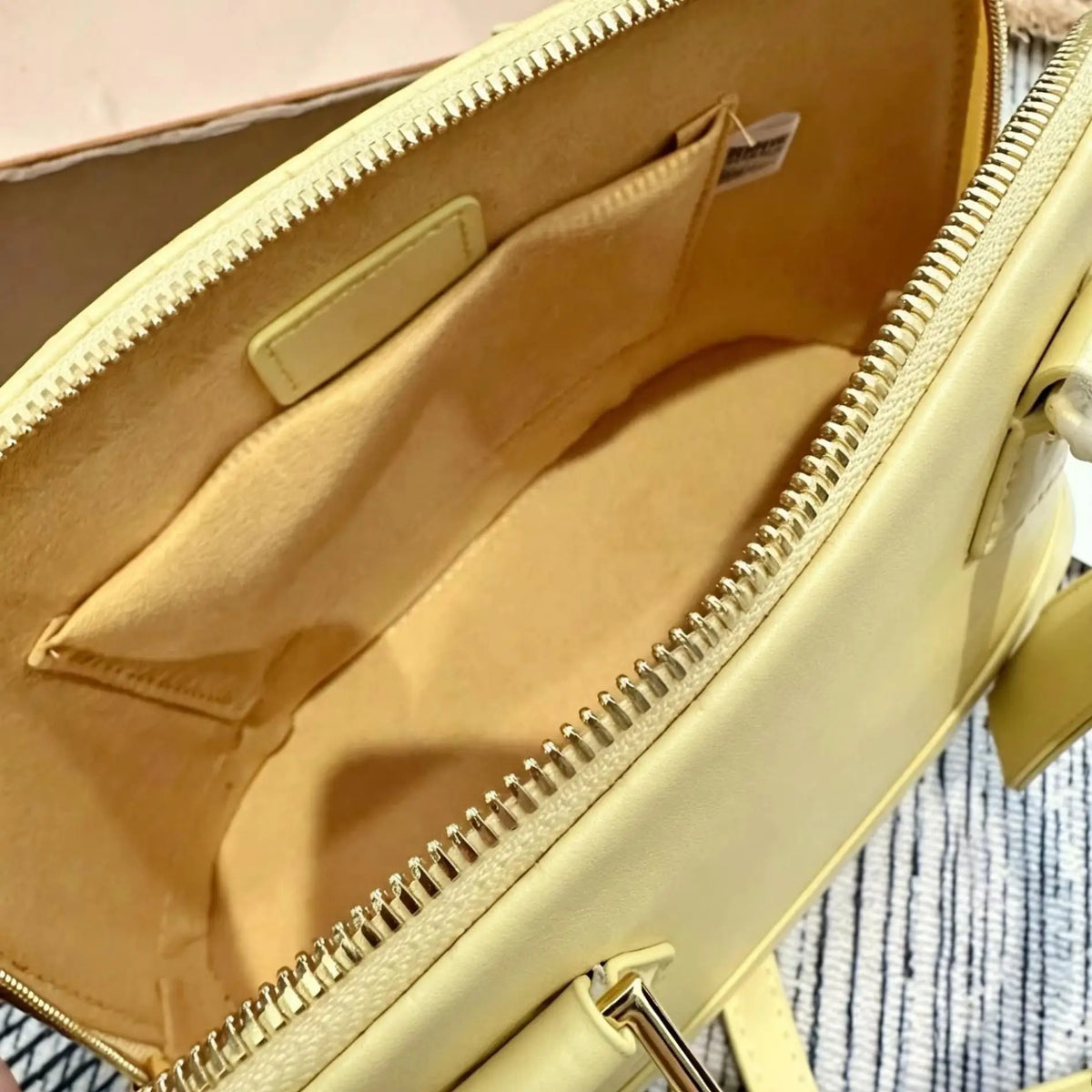 Yellow smooth calf leather handbag, with gold-tone lock hardware, top handle, detachable matching crossbody strap, small shell shoulder bag.