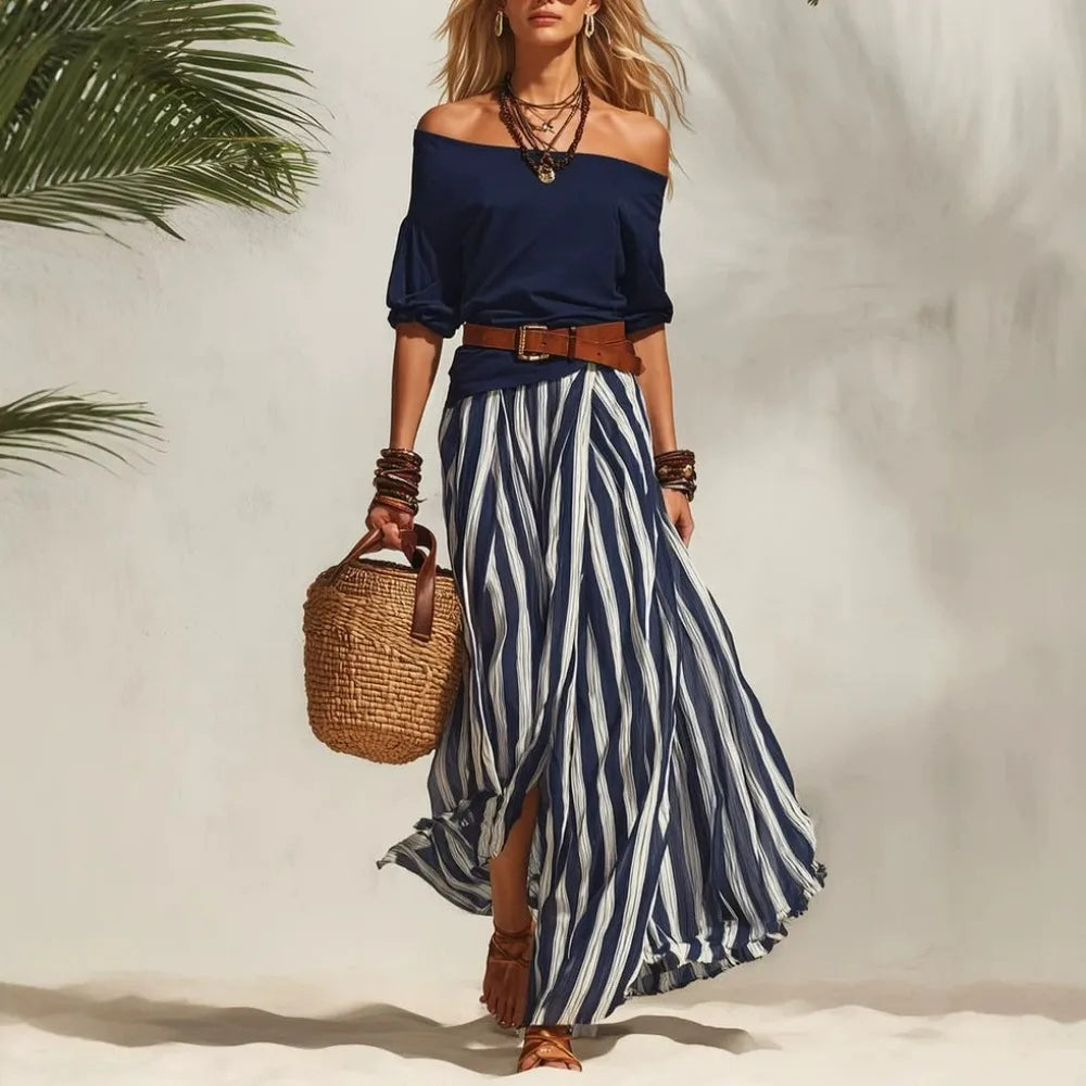 Completo da donna con top a maniche a sbuffo e gonna lunga a righe
