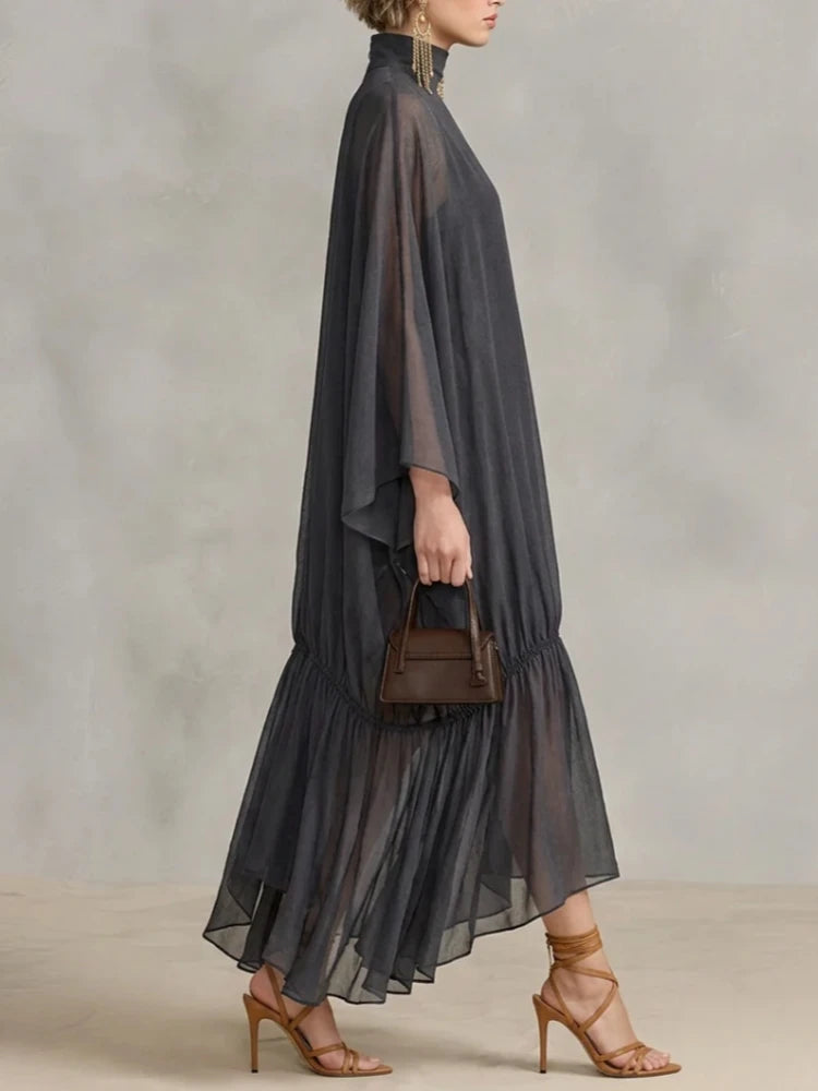 Abito lungo in chiffon semitrasparente con maniche a pipistrello
