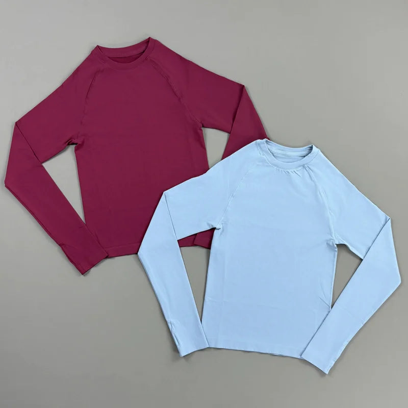 Maglia sportiva donna, maniche lunghe e asole per pollici