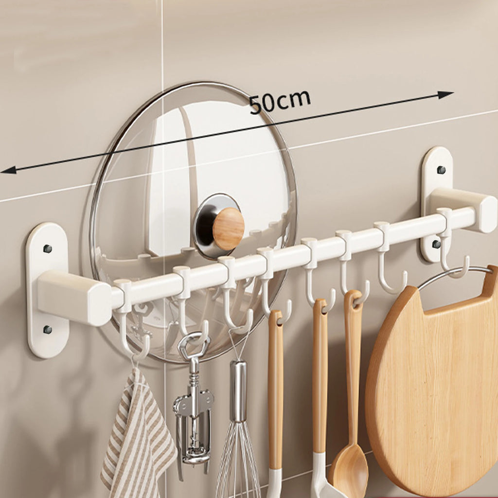 1 estante de almacenamiento para utensilios de cocina, como tapas de ollas y espátulas, con ganchos de pared y múltiples opciones de almacenamiento para artículos de cocina