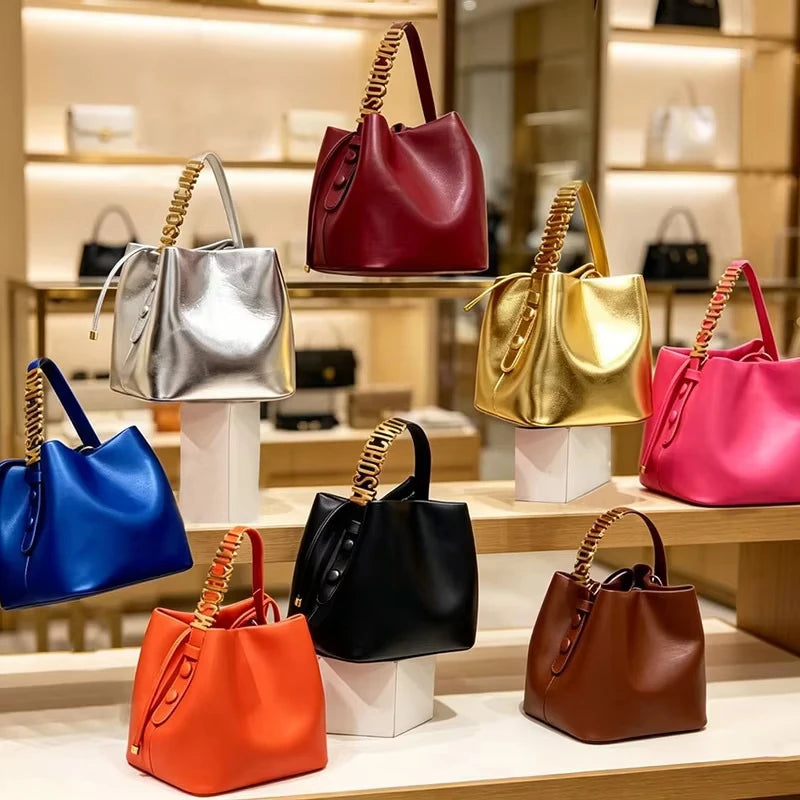 2026 New Light Luxury Drawstring Bucket Bag Trendy Gold Letter Handheld Crossbody Bucket Bag for Women Mini Shoulder Bag.