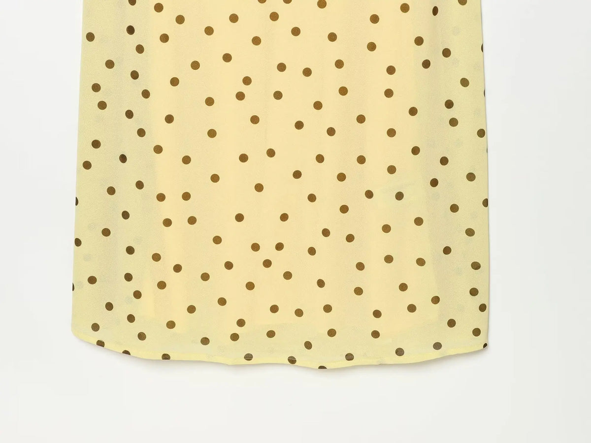 Abito lungo giallo a pois con arricciatura in vita