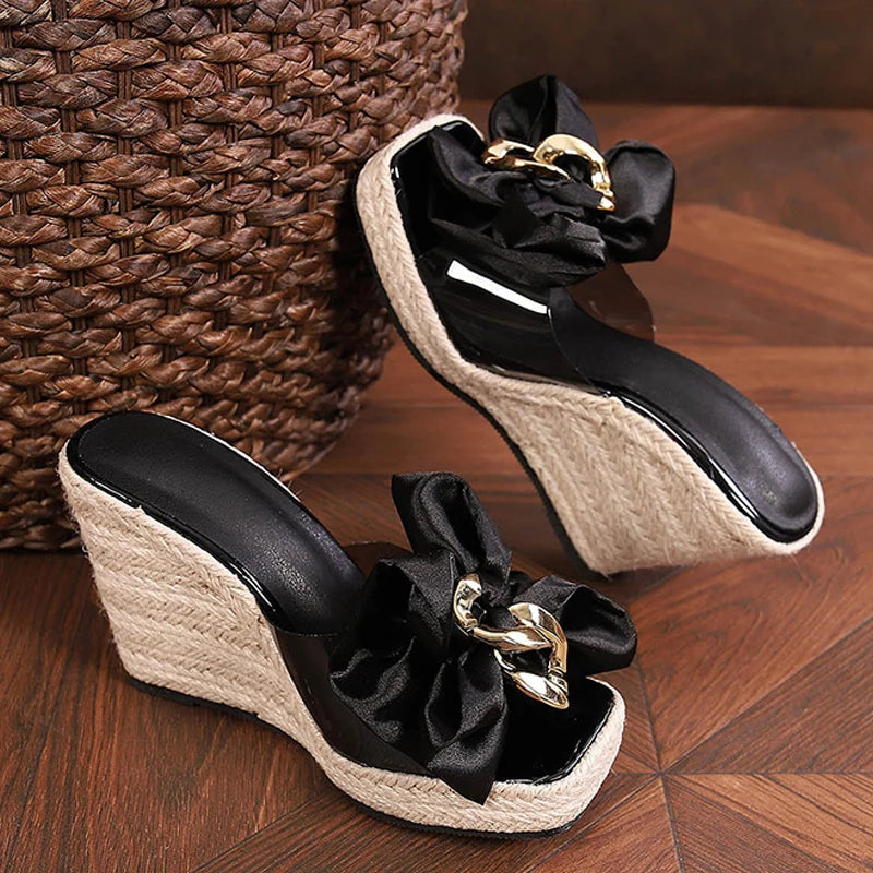 Mules donna Liyke con zeppa intrecciata e fiocco