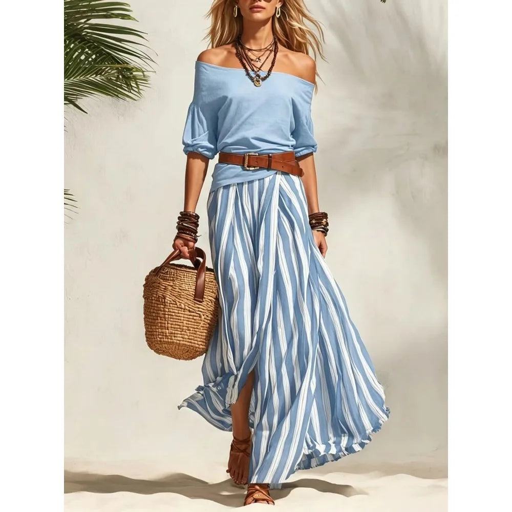 Completo da donna con top a maniche a sbuffo e gonna lunga a righe