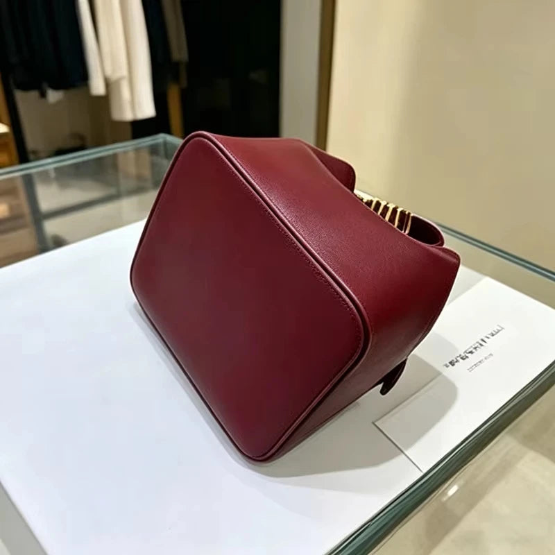 2026 New Light Luxury Drawstring Bucket Bag Trendy Gold Letter Handheld Crossbody Bucket Bag for Women Mini Shoulder Bag.