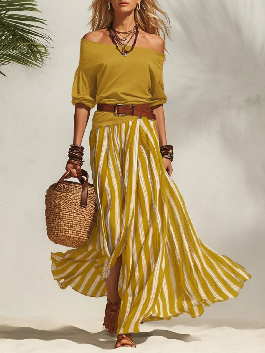Completo da donna con top a maniche a sbuffo e gonna lunga a righe