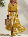 Completo da donna con top a maniche a sbuffo e gonna lunga a righe