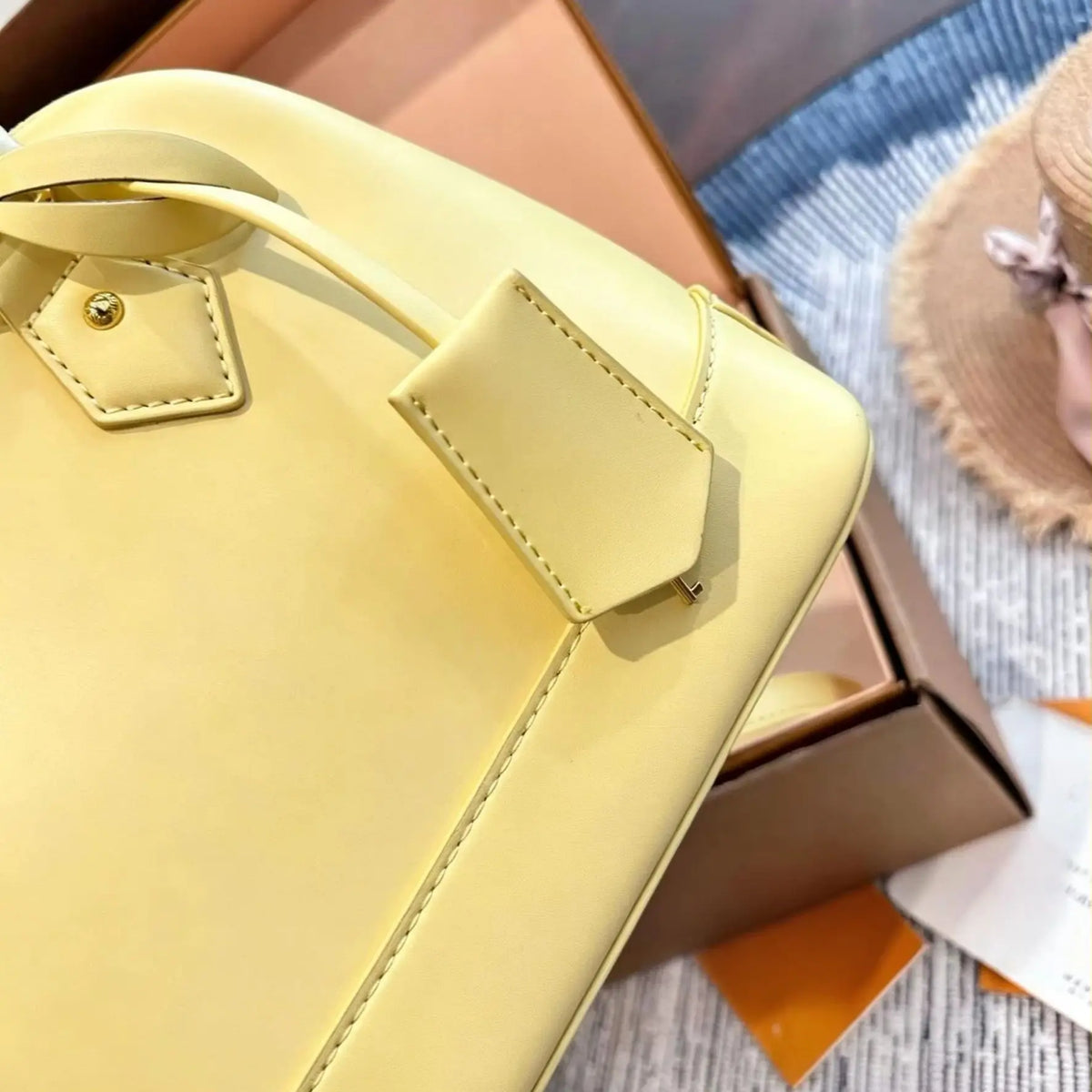 Yellow smooth calf leather handbag, with gold-tone lock hardware, top handle, detachable matching crossbody strap, small shell shoulder bag.